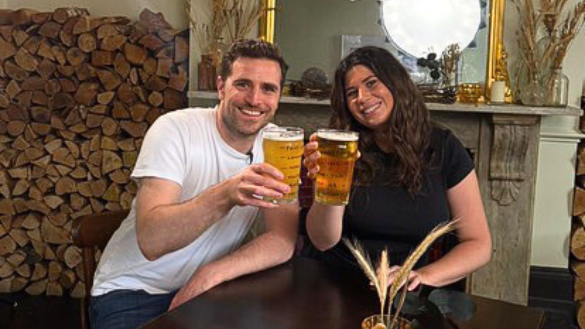an image of alexander dragonetti and Shortlist interviewer cheers-ing full pint glasses at the Mall Tavern pub in Notting Hill
