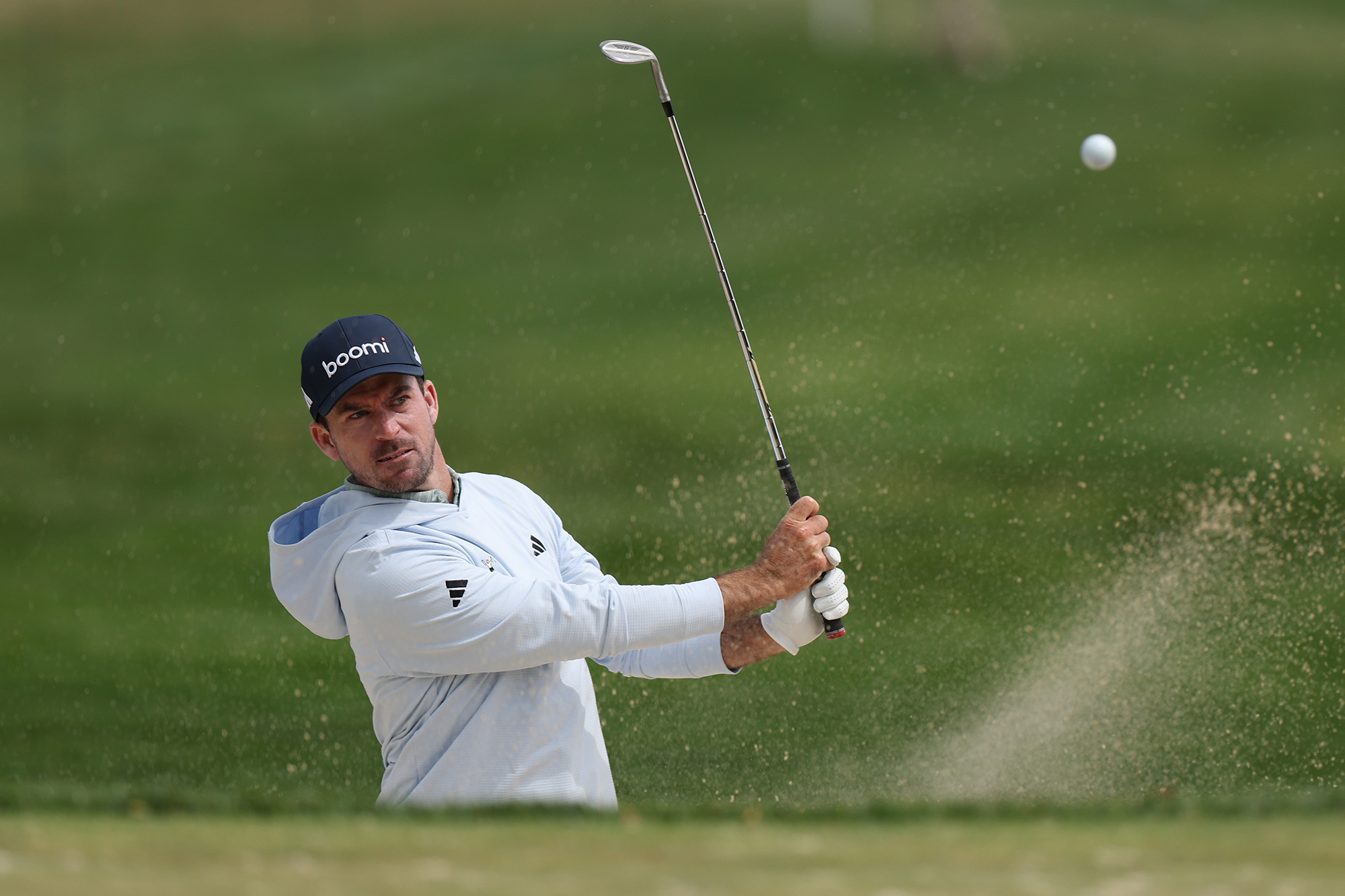 Nick Taylor hitting a bunker shot
