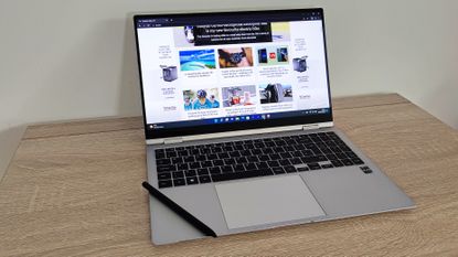 Samsung Galaxy Book2 Pro 360 review: woman drawing on a laptop laid out flat on a desk