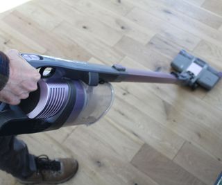 Testing the Shark Pet Cordless Stick Vacuum on a hard floor