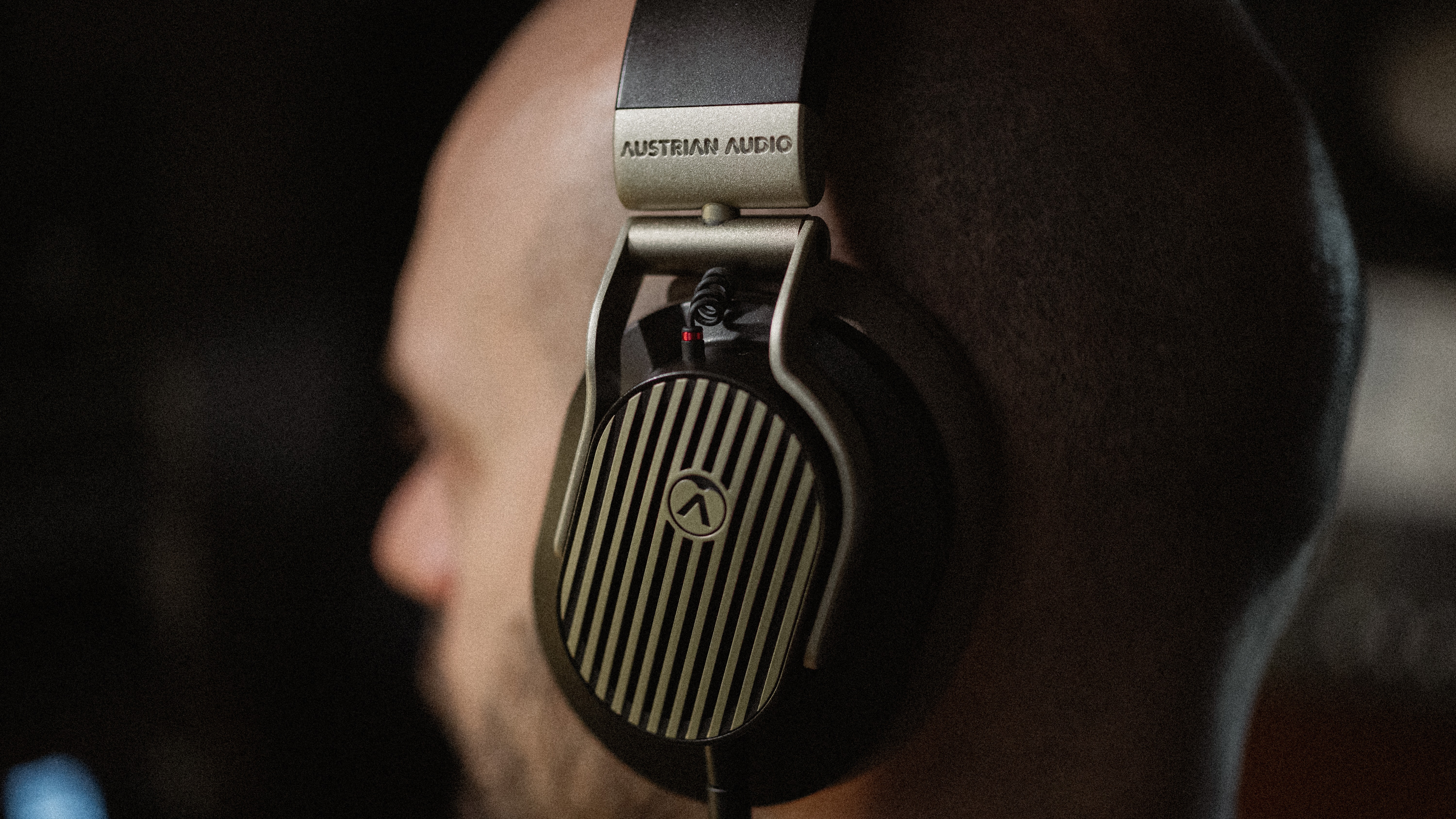 Austrian Audio The Arranger over-ear headphones being worn on the head of a man