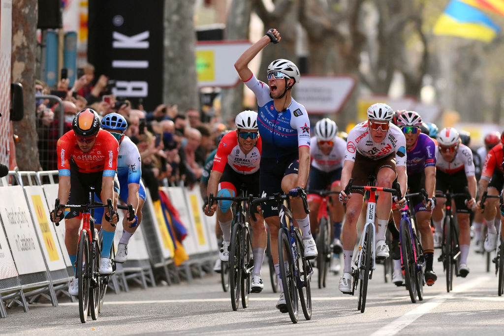 VILANOVA I LA GELTRU SPAIN MARCH 25 Ethan Vernon of United Kingdom and Team QuickStep Alpha Vinyl celebrates at finish line as stage winner ahead of Phil Bauhaus of Germany and Team Bahrain Victorious Guillaume Boivin of Canada and Team Israel Premier Tech Kaden Groves of Australia and Team BikeExchange Jayco Dorian Godon of France and AG2R Citren Team and Martin Laas of Estonia and Team Bora Hansgrohe during the 101st Volta Ciclista a Catalunya 2022 Stage 5 a 2063km stage from La Pobla de Segur to Vilanova i la Geltr VoltaCatalunya101 WorldTour on March 25 2022 in Vilanova i la Geltru Spain Photo by David RamosGetty Images