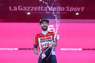NAPOLI ITALY MAY 14 Thomas De Gendt of Belgium and Team Lotto Soudal celebrates winning the stage on the podium ceremony after the 105th Giro dItalia 2022 Stage 8 a 153km stage from Napoli to Napoli Giro WorldTour on May 14 2022 in Napoli Italy Photo by Michael SteeleGetty Images
