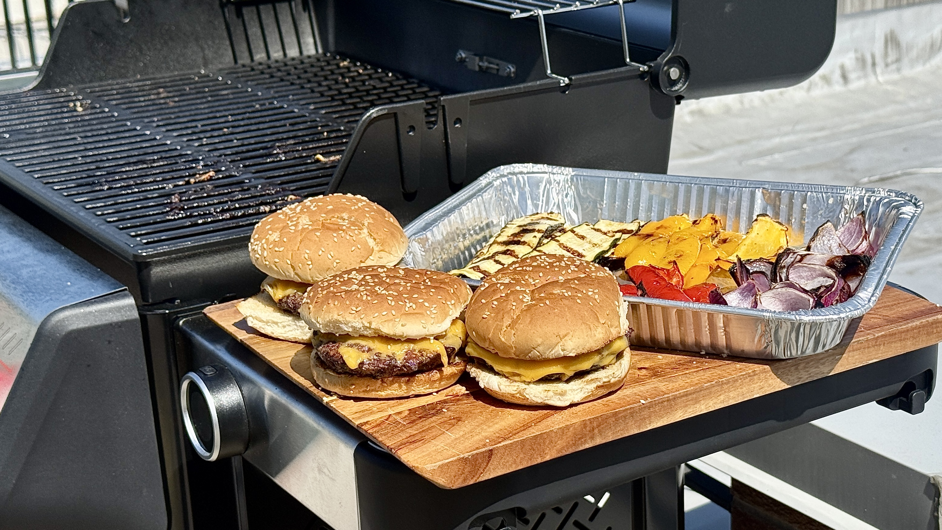 Burgers and vegetables cooked on Weber Spirit grill