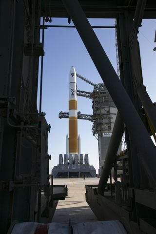 Delta IV rocket stands poised to launch AFSPC-6 military satellites.