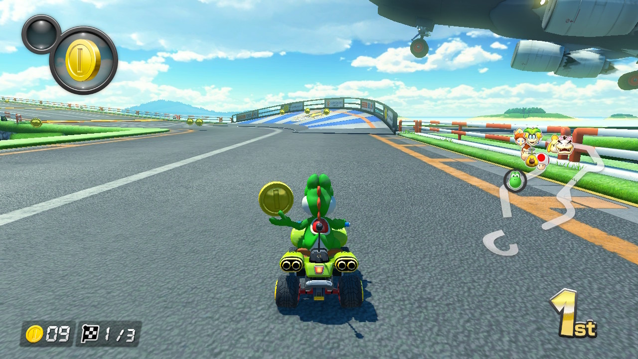 Mario Kart 8 Deluxe screenshot showing Yoshi on a course about to use a coin powerup