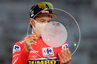 Team Jumbos Slovenian rider Primoz Roglic celebrates on the podium after winning the 2020 La Vuelta cycling tour of Spain at the end of the 18th and final stage a 1242km race from the Zarzuela racecourse to central Madrid on November 8 2020 Photo by OSCAR DEL POZO AFP Photo by OSCAR DEL POZOAFP via Getty Images