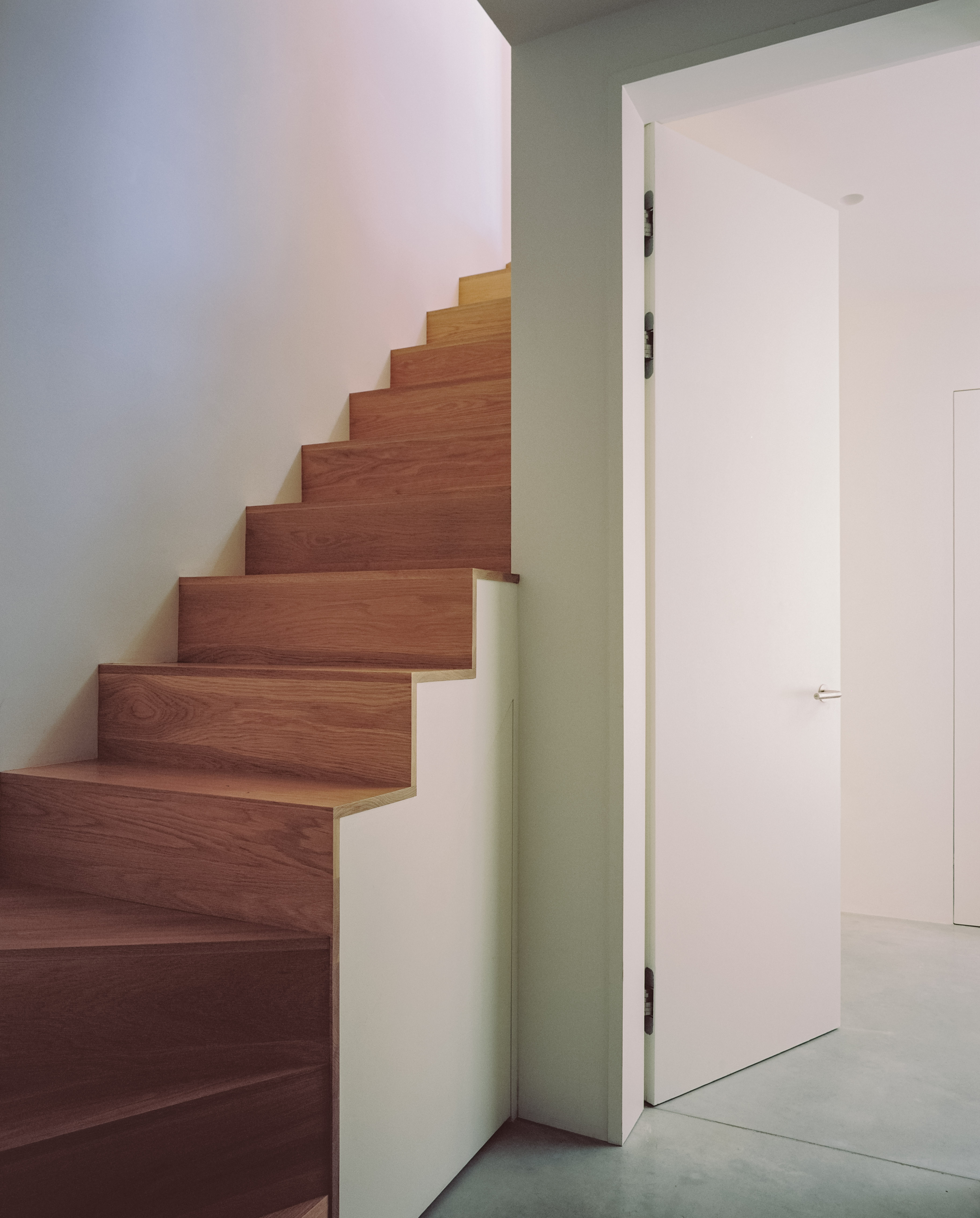 The staircase leading down to the basement level