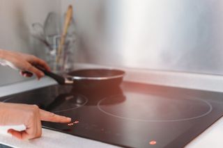 induction hob with pan on top of it