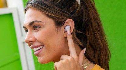 JLab Go Air Pop review: woman wearing true wireless earbuds