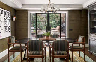 blue and yellow patterned rug in 60s inspired dining room