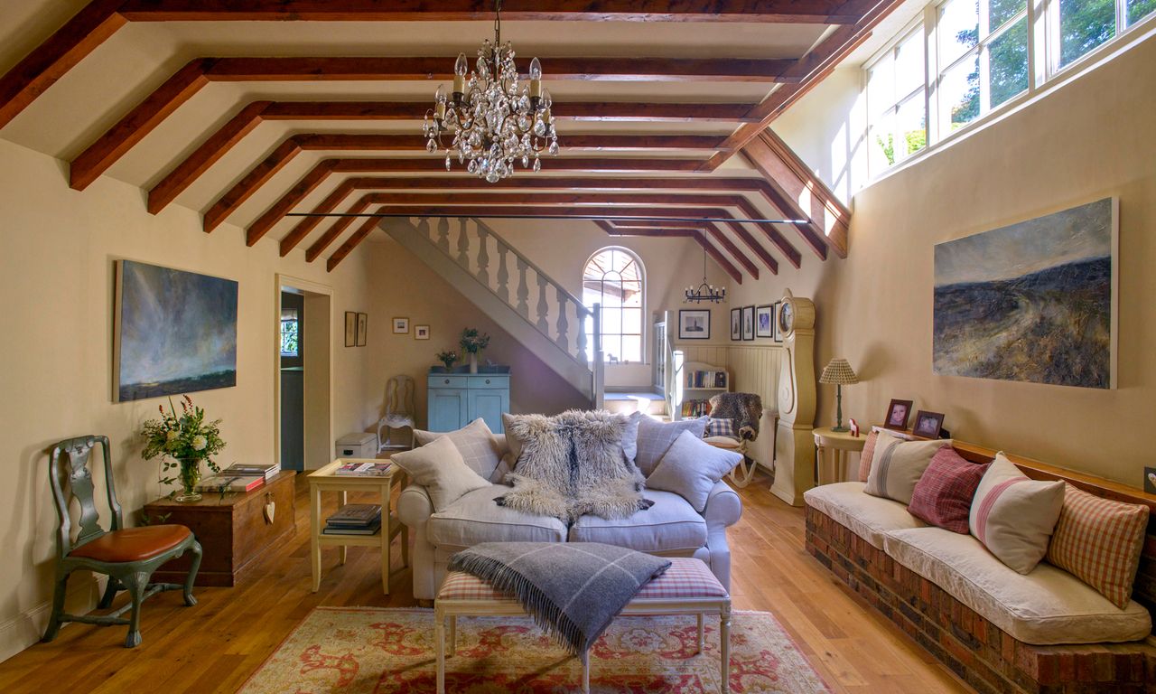 White walls with wooden flooring and sofa