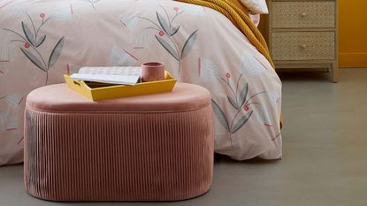 Dunelm's Eloise Velvet Pleated Storage Ottoman in pink in bedroom at bottom of bed