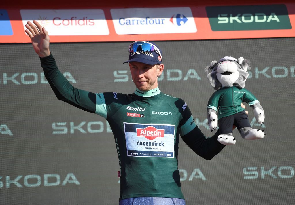 The points ranking leader, Team Alpecin's Kaden Groves, celebrates on the podium wearing the green jersey during the stage 19 of the Vuelta a Espana, a 173,5 km race between Logrono and Alto de Moncalvillo, on September 6, 2024. (Photo by ANDER GILLENEA / AFP)