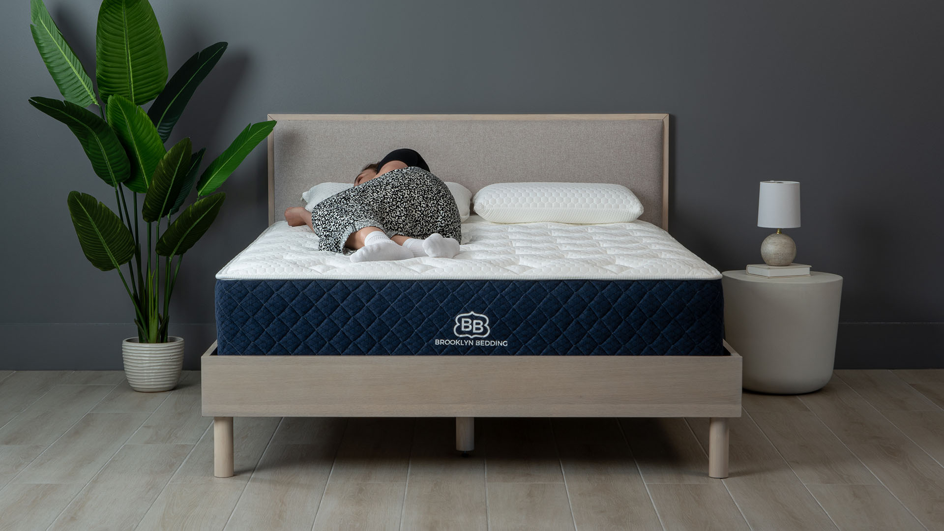 Brooklyn Bedding Signature Hybrid mattress with Tom's Guide Sleep Editor lying on it