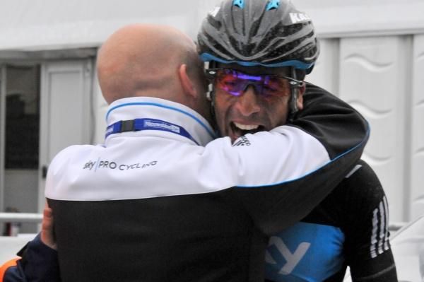 Dave Brailsford embraces Juan Antonio Flecha at the finish of Omloop Het Nieuwsblad