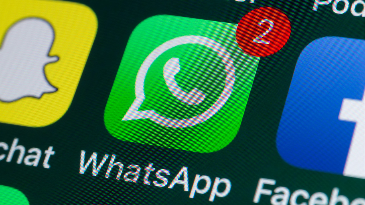 Green and white WhatsApp app with red message notification