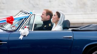 Prince William and Kate Middleton driving away on their wedding day