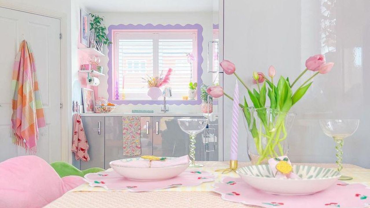 A pink dining table in a kitchen