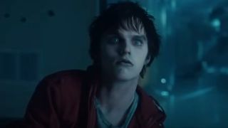Nicholas Hoult as a zombie looking wide-eyed in Warm Bodies.