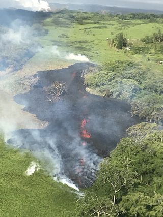At 8 a.m. Hawaii Standard Time (HST) on May 13, a slow and sticky flow emerges from a new fissure — No. 17 — northeast at the end of Hinalo Street.