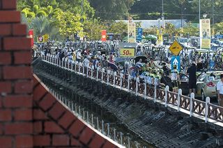 Teams in the 2011 Tour de Langkawi prepare for the start to stage one on Langkawi Island.