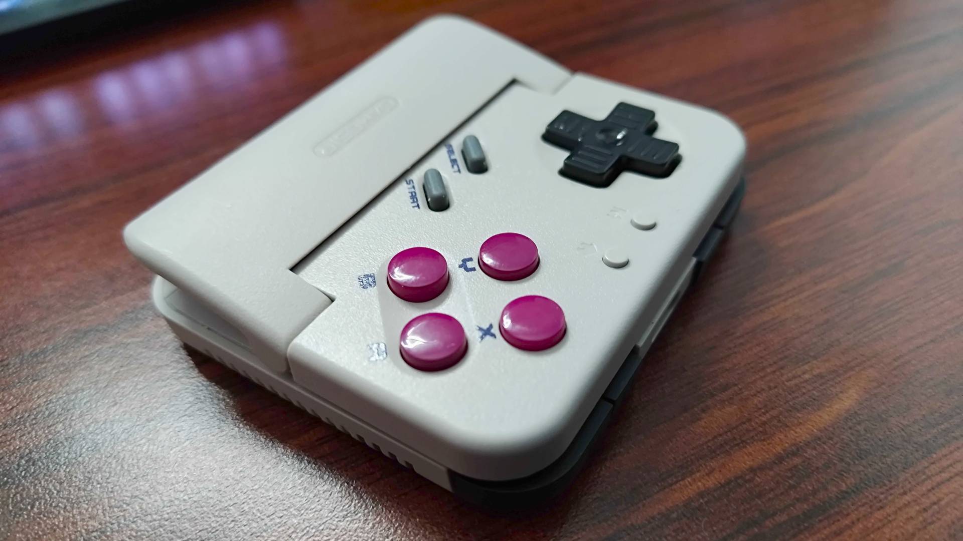 Side view of Gamesir Pocket Taco on desk.