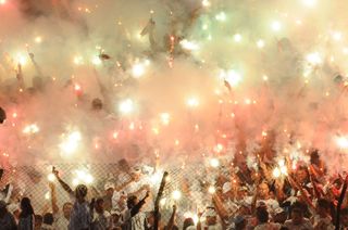 Santos fans light flares ahead of a Copa Libertadores game against Corinthians in 2012.