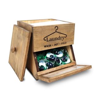 A Wooden, Free Standing Laundry Room Organizer with label, detachable lid and flip-down door