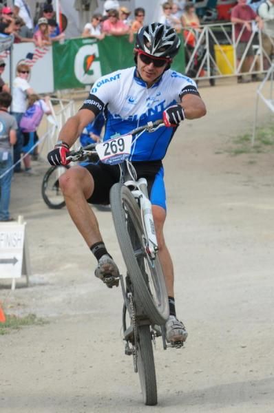 Adam Craig (Giant) finishes second and pops his trademark wheelie.