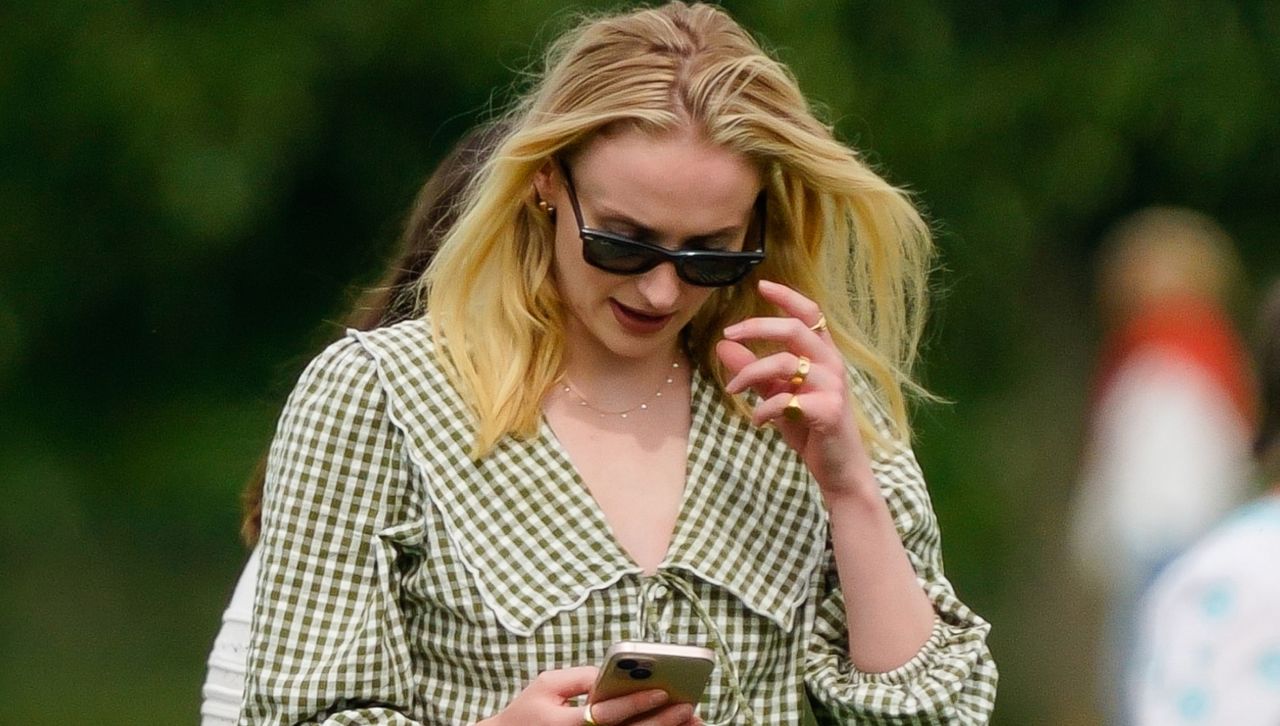 Sophie Turner attends a polo match wearing a peter pan collar shirt and jeans