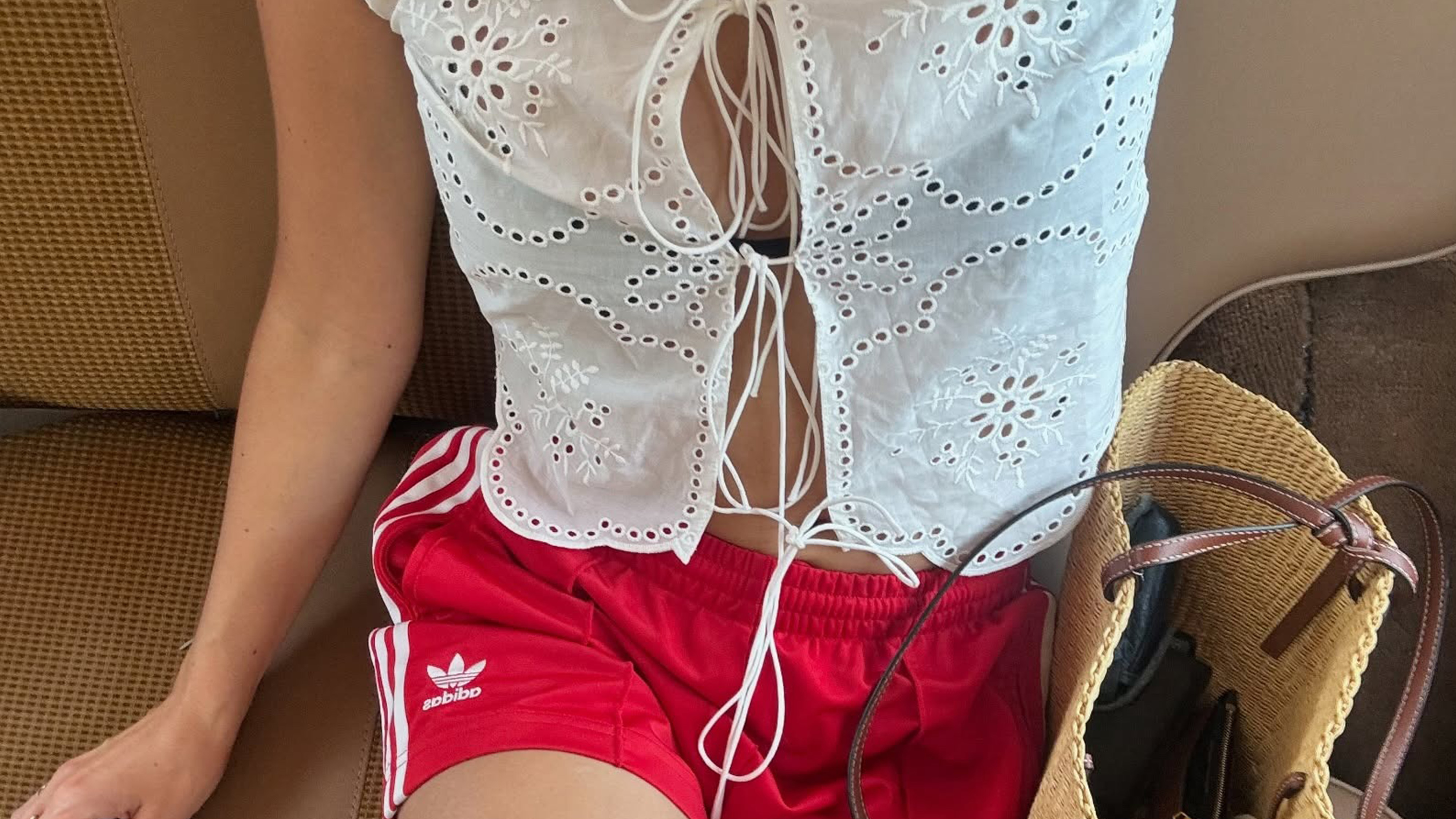 Anne Laure Mais wearing a white blouse and Adidas shorts.