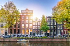 Canals in Amsterdam with buildings in background