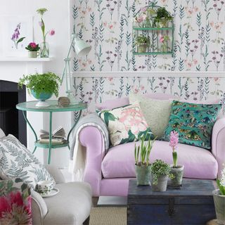 floral wallpaper room with pink sofa