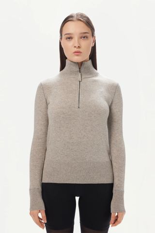 grey jumpers - woman wearing high neck zipped knit