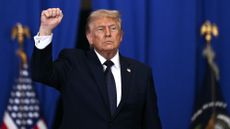 Trump raises his fist in the air
