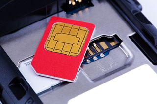 A SIM card on top of a mobile 