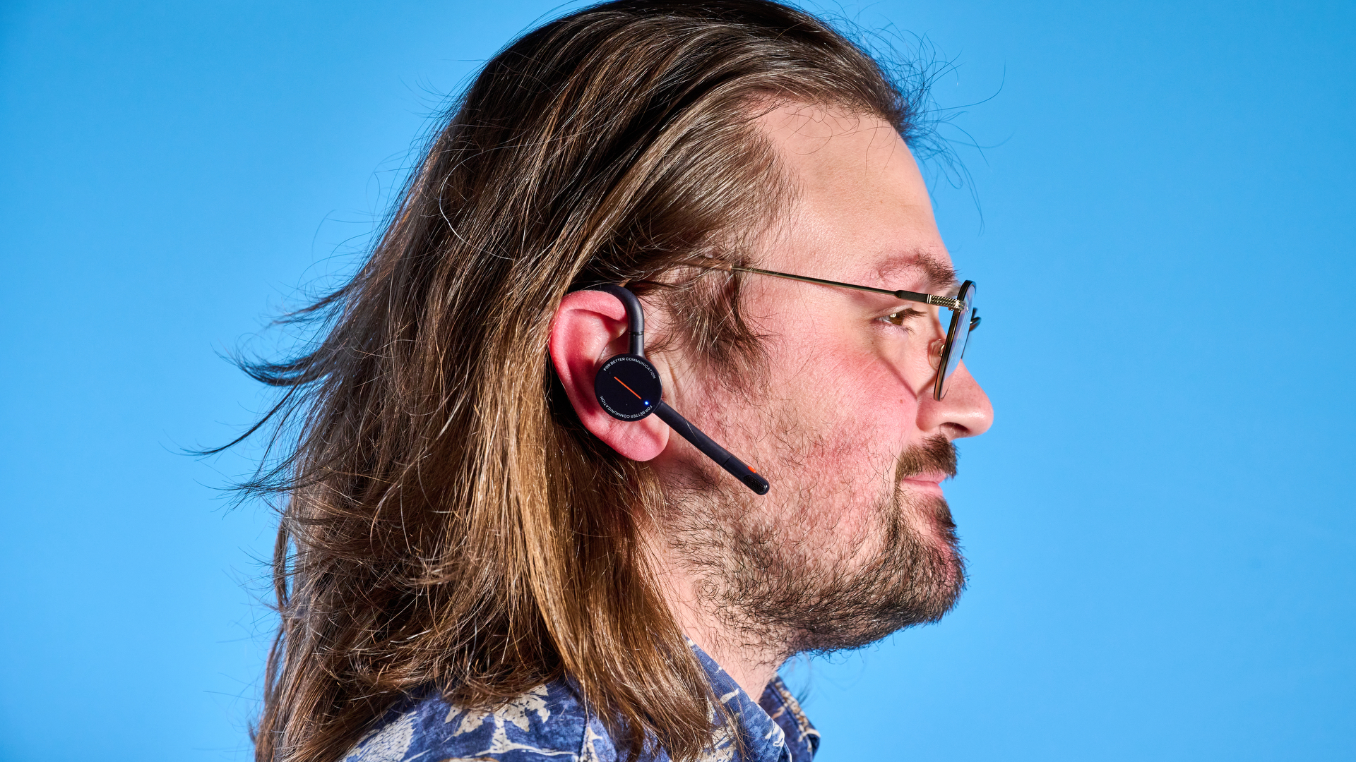 Oleap Archer AI Meeting Headset photographed in front of a blue background.