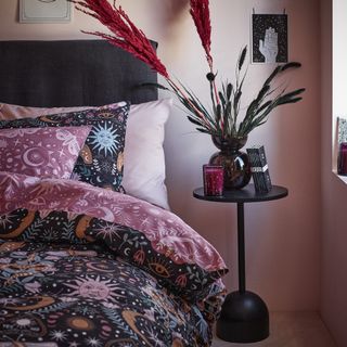 bedroom with bedding and side table