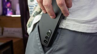 Putting the folded Samsung Galaxy Z Fold 3 in a shorts pocket