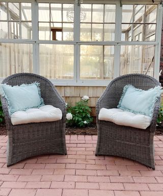 A DIY brick patio with armchairs