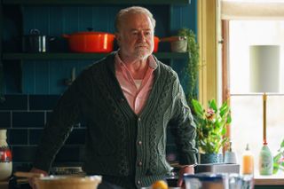 Owen Teale in a green cardigan as Oliver Anchor-Ferrers in Wolf..