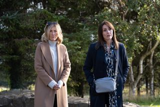 Eve Best as Rosaline and Suranne Jones as Becca in Maryland, standing in front of some trees