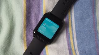 Close-up of Realme Watch 2 screen. showing weather report