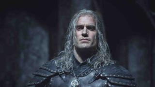 henry cavil as geralt in the witcher season 2 in a shadowy location