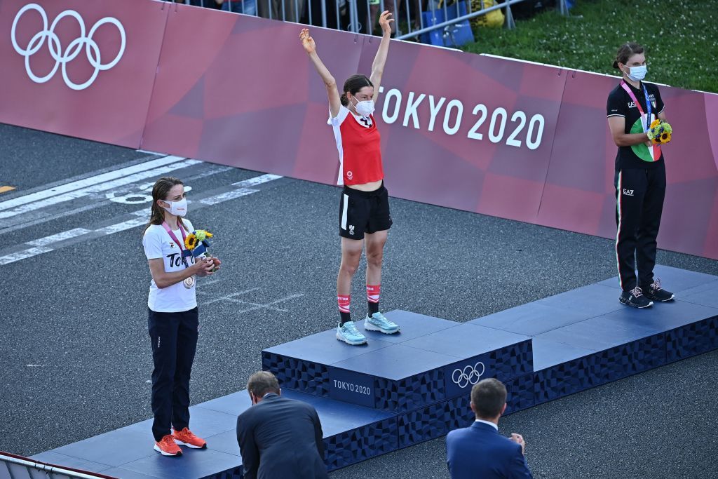 LR Silver medallist Netherlands Annemiek Van Vleuten Gold medallist Austrias Anna Kiesenhofer and bronze medallist Italys Elisa Longo Borghini celebrate on the podium during the medal ceremony for the womens cycling road race of the Tokyo 2020 Olympic Games at the Fuji International Speedway in Oyama Japan on July 25 2021 Photo by Ben STANSALL AFP Photo by BEN STANSALLAFP via Getty Images