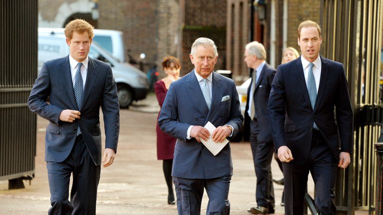Princes Harry, Charles, and William walking