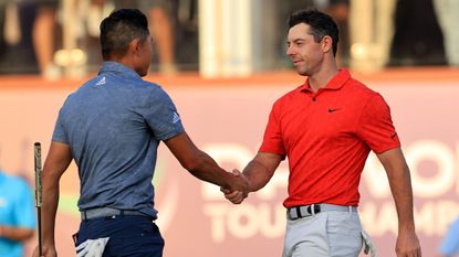 Collin Morikawa and Rory McIlroy shake hands