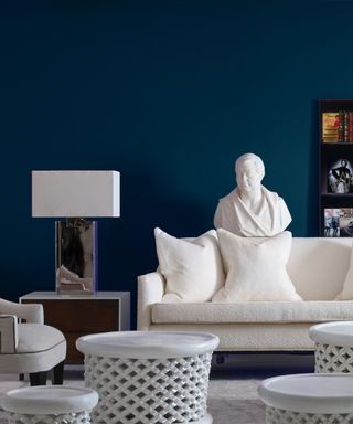 Blue painted room with art and sculptors