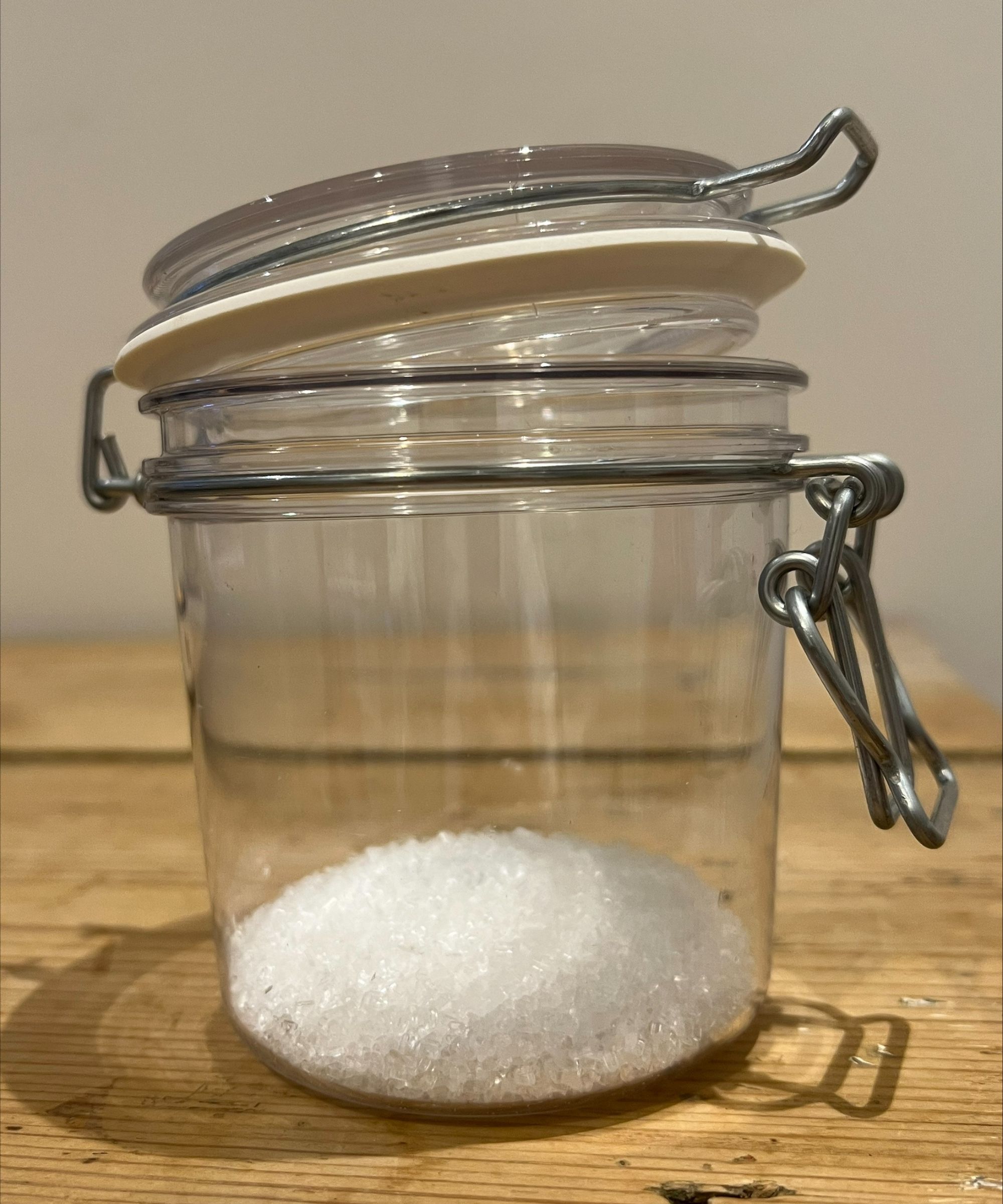 A mason jar of epson salts with essential oil added from home smelling salt fragrancing